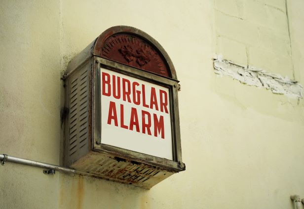 Old burglar alarm with rust